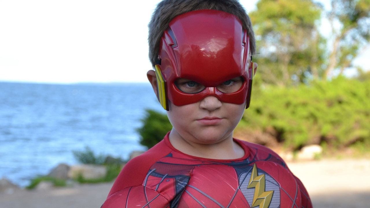 The Flash showed off his blinding speed as he ran across and around the park for us.