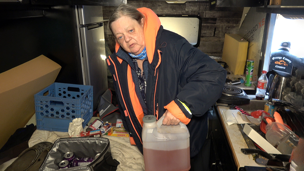 Diane Marche showed me her son’s ‘piss bucket’ that he had to use as the plumbing was frozen.